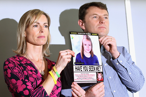 Kate and Gerry McCann with a photo of Madeleine McCann