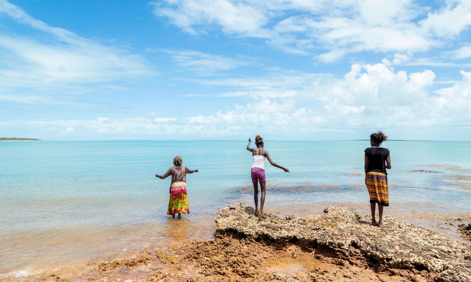 Image showing indigenous women rock fishing in australia