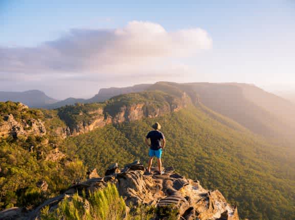 man standing on mountain