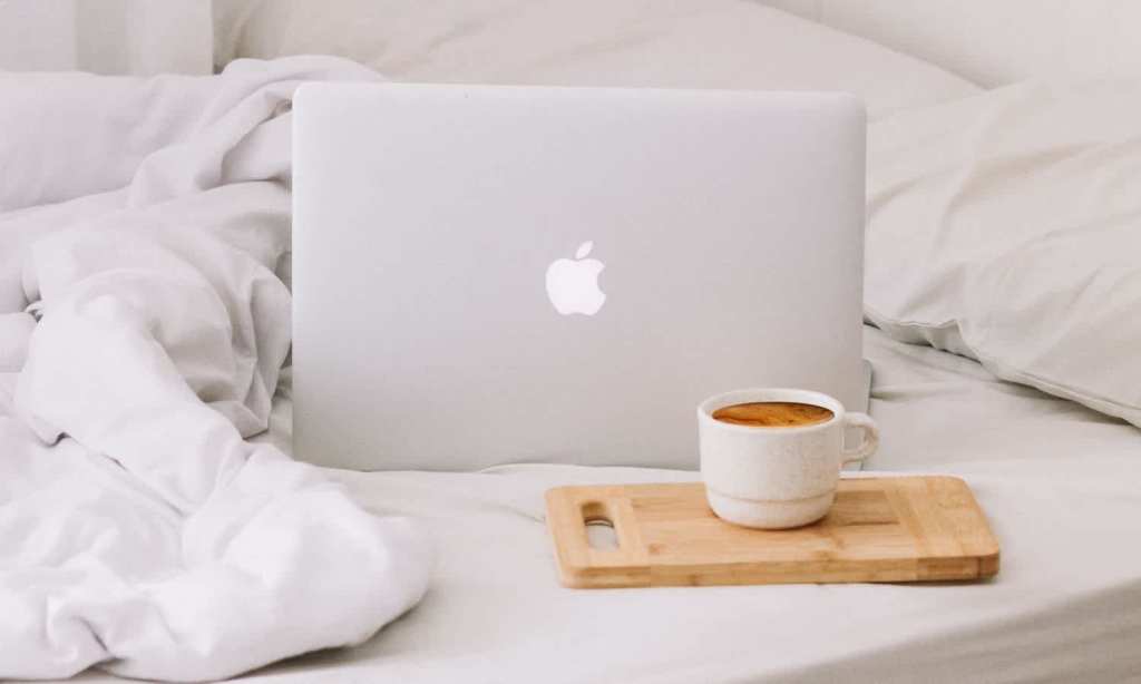 Laptop on bed