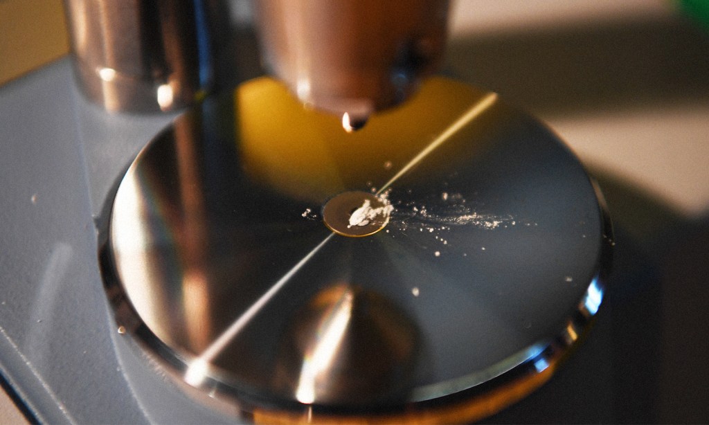 Pill testing Australia demonstration at CanTEST in Canberra. Image showing a sample of drugs to be tested on a medical machine.