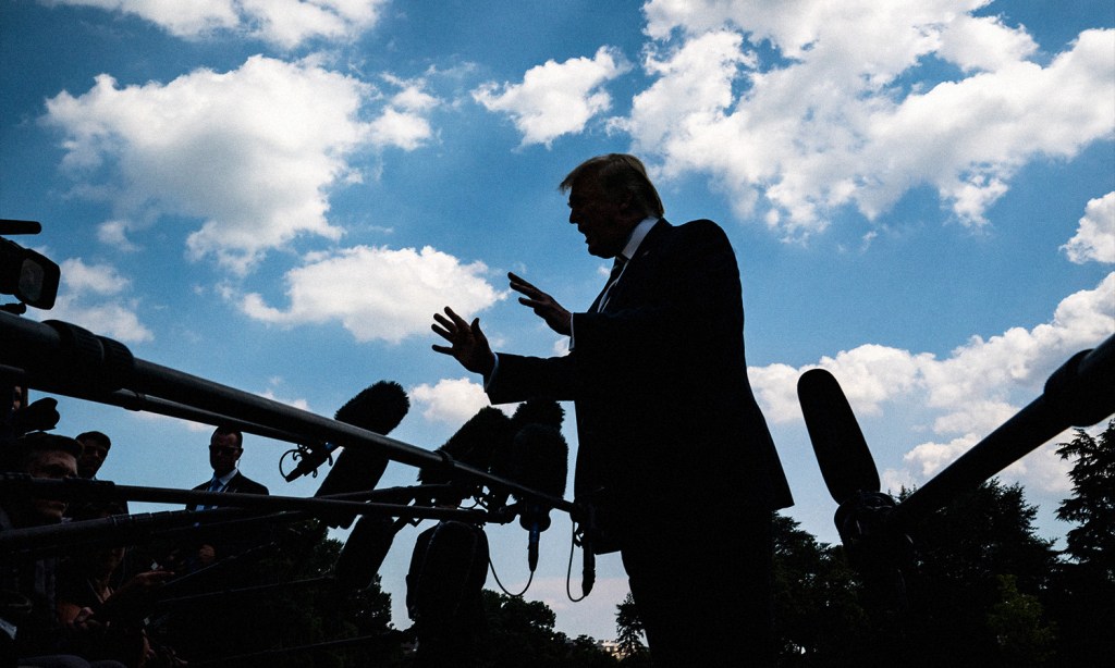 Donald Trump claims he might be arrested on Tuesday. Image shows Trump sihlouetted against a blue sky with white clouds.