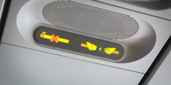 An image showing a no smoking sign on a plane to illustrate an artilce about whether or not you can bring a vape on a plane in australia.