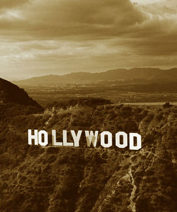 Photo of Hollywood Sign c 1991. The WGA is on strike for the first time since 2007. But what is the writers strike? And how does AI play a role?