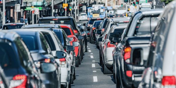 An image of traffic stopped when it could be being used to charge an EV